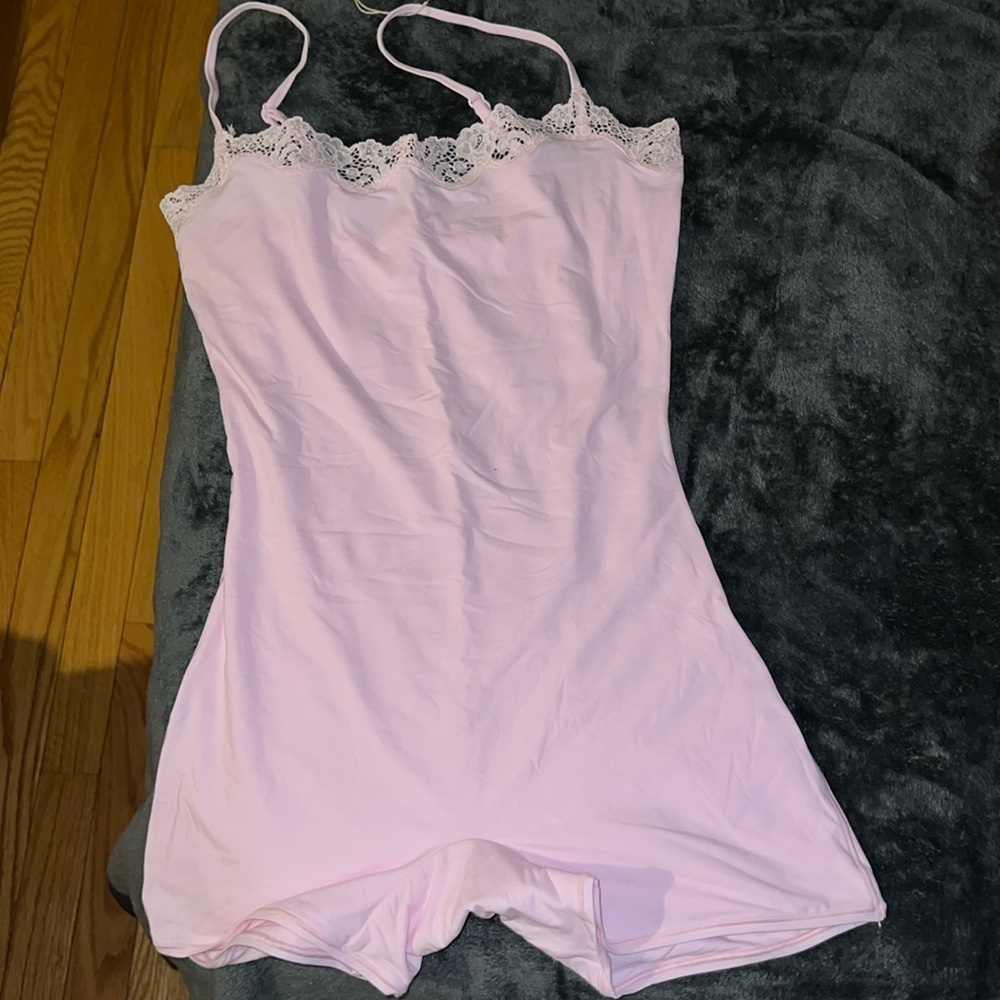 Fits everybody lace onesie